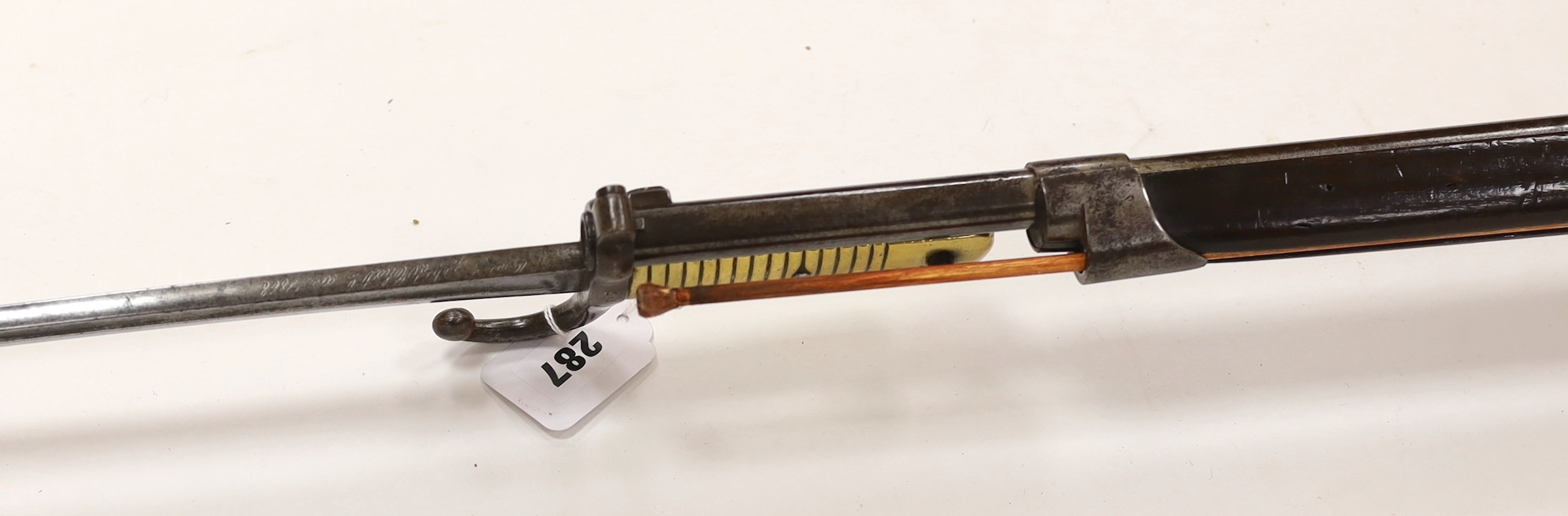 A French Chassepot bolt action rifle 1865-1874 with regulation, iron mounts, and 1868 brass handle bayonet dated 1868, barrel 79cm
